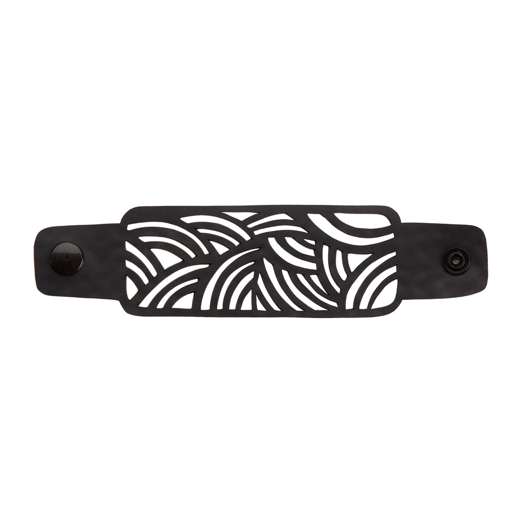 Paguro Upcycle black cuff with wave cutout pattern and snap closure recycled rubber bracelet