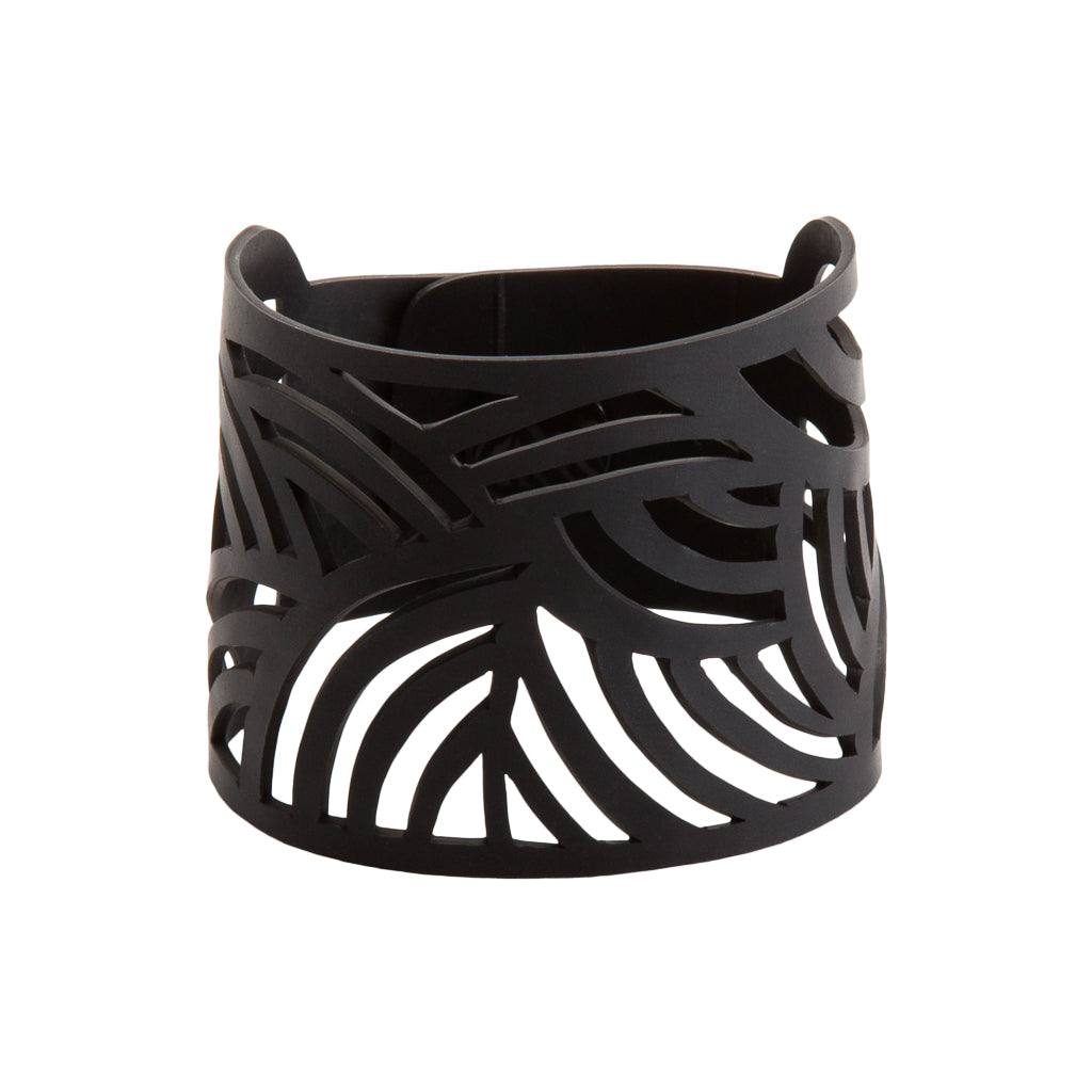 Paguro Upcycle black laser cut cuff recycled rubber bracelet with wave cutout design flexible eco accessory