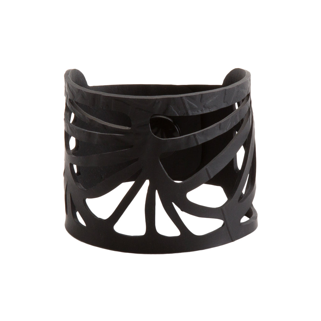 Paguro Upcycle black cuff with floral cutout design recycled rubber bracelet for eco conscious style