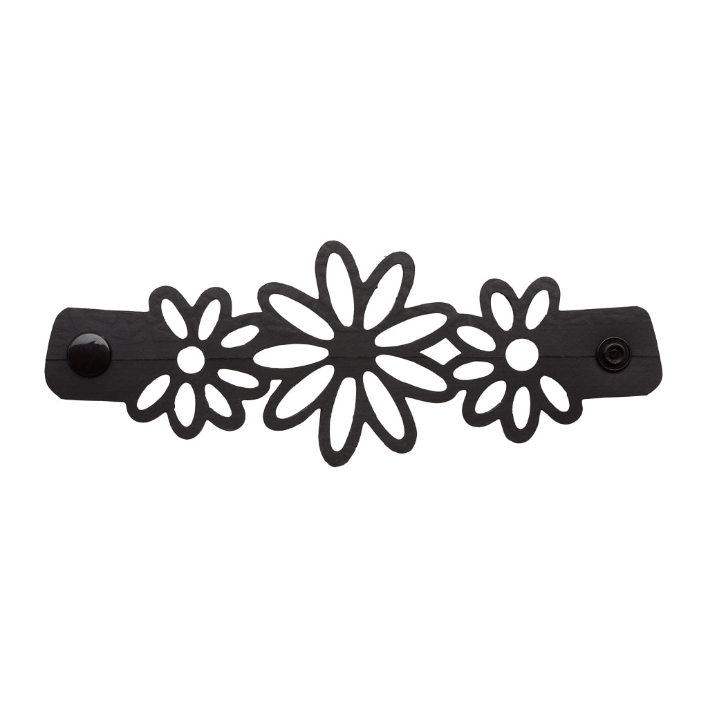 Paguro Upcycle black recycled rubber bracelet with floral cutout design and snap closure