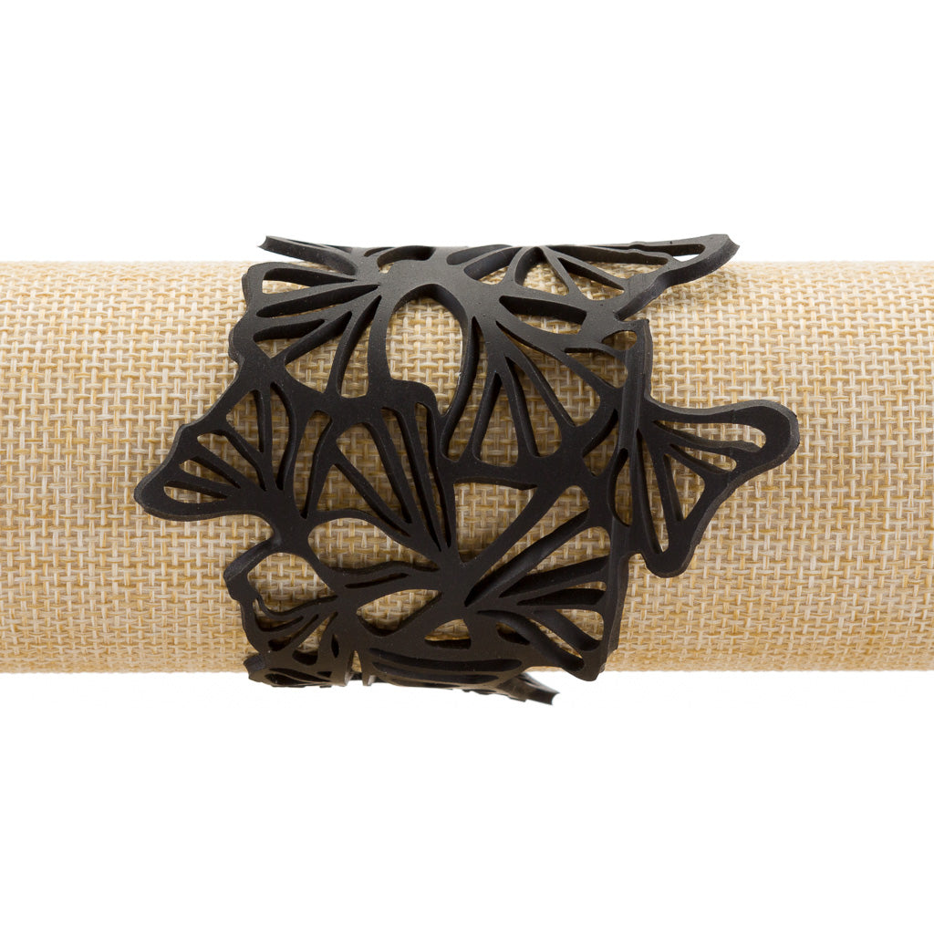 Paguro Upcycle black upcycled rubber bracelet with intricate cutout clover leaf design